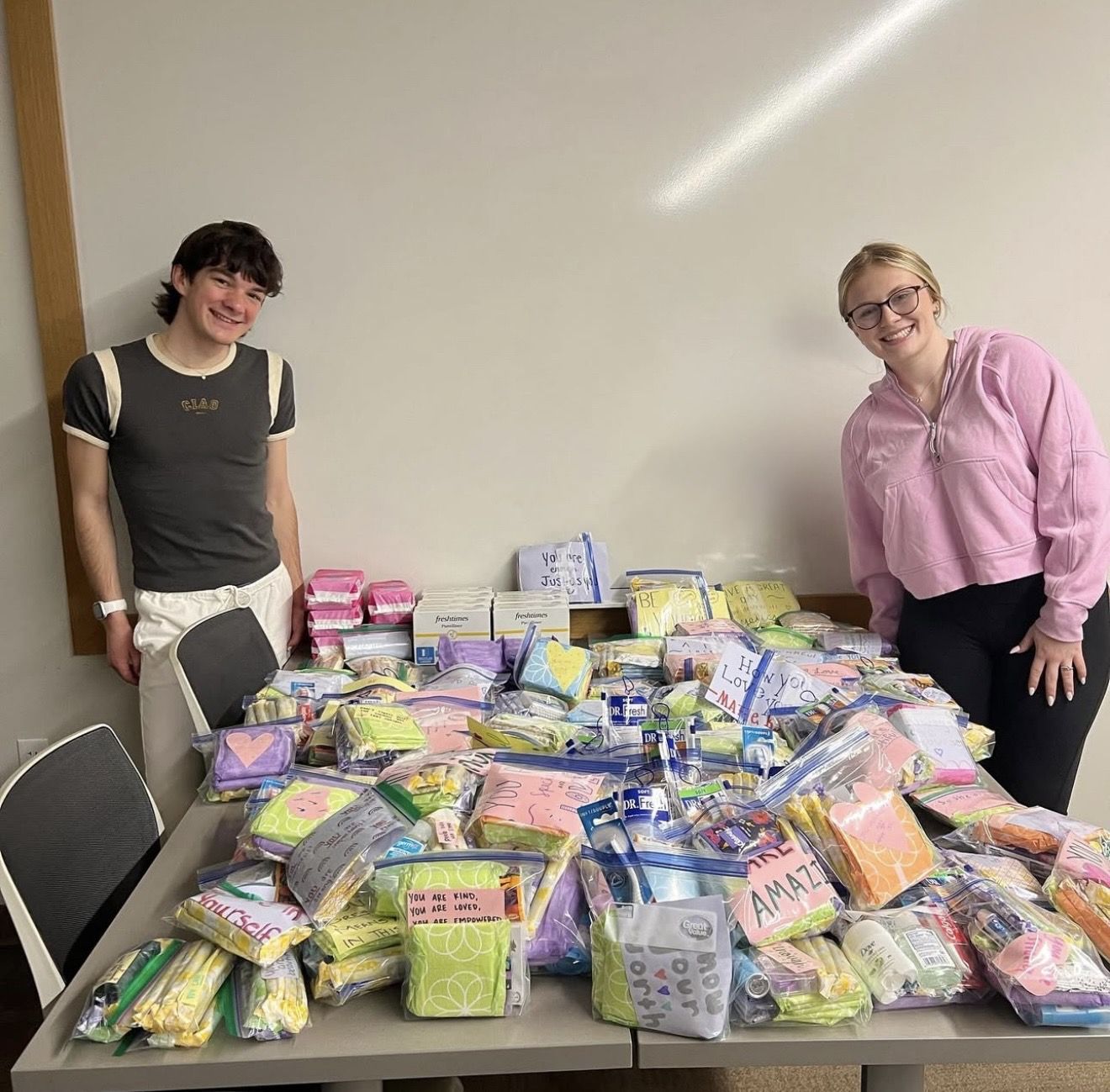 Members packing hygiene kits for women in need